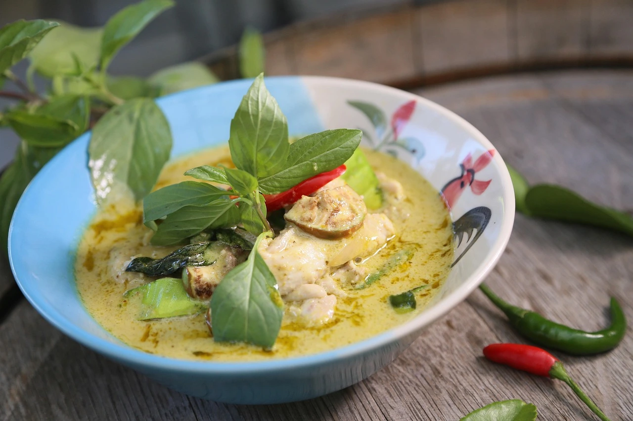 Authentic Thai green curry with chicken, coconut milk and Thai basil served with jasmine rice