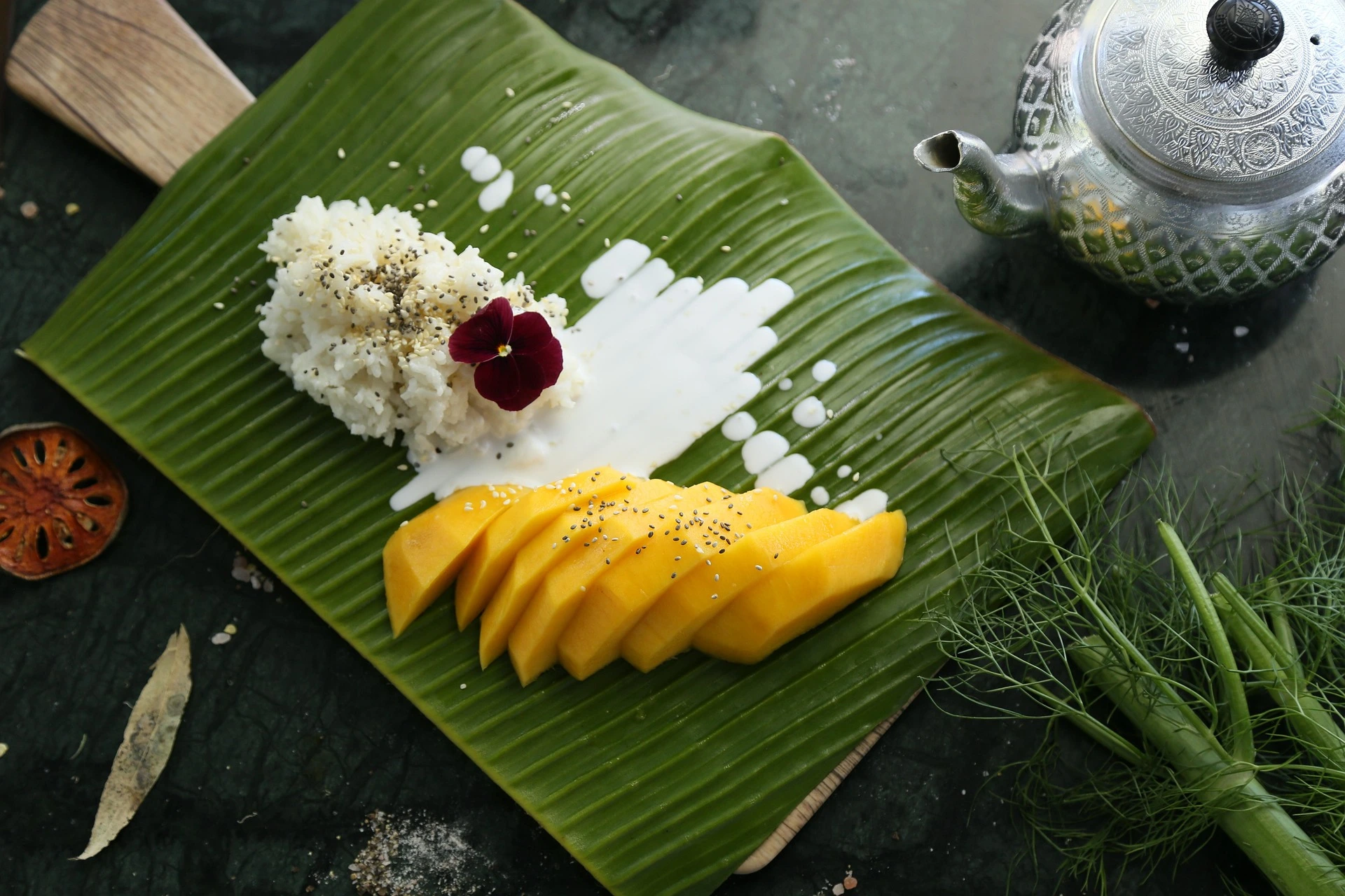 Authentic Mango Sticky Rice with sweet coconut sticky rice and fresh ripe mango in Thailand